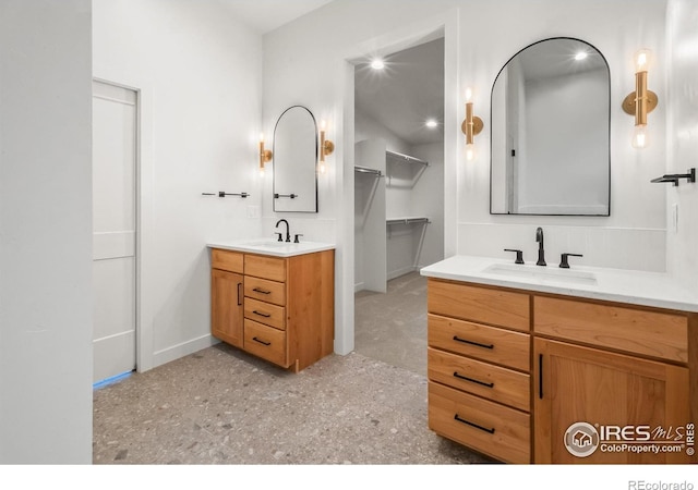 2009 18th Ave, Greeley, CO 80631 - bathroom featuring two vanities and a closet