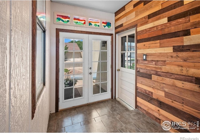 7414 Benton St, Arvada, CO 80003 - entryway with french doors and wood walls