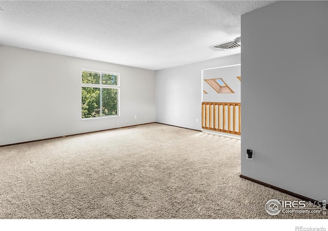 7414 Benton St, Arvada, CO 80003 - carpeted spare room featuring a textured ceiling and baseboards