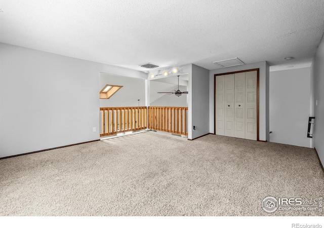 7414 Benton St, Arvada, CO 80003 - spare room with carpet, a textured ceiling, attic access, and ceiling fan