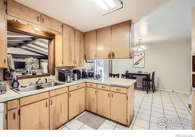 1036 Meadowbrook Dr, Fort Collins, CO 80521 - kitchen with a peninsula, light countertops, light tile patterned flooring, light brown cabinets, and vaulted ceiling