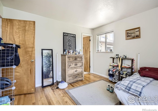 1036 Meadowbrook Dr, Fort Collins, CO 80521 - bedroom with light wood-type flooring and baseboards