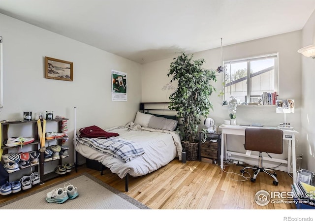 1036 Meadowbrook Dr, Fort Collins, CO 80521 - bedroom featuring wood finished floors and an office area