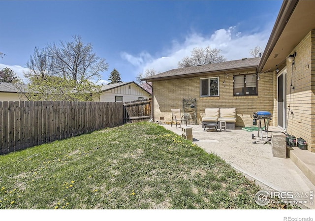 1036 Meadowbrook Dr, Fort Collins, CO 80521 - fenced backyard with a patio area and an outdoor hangout area