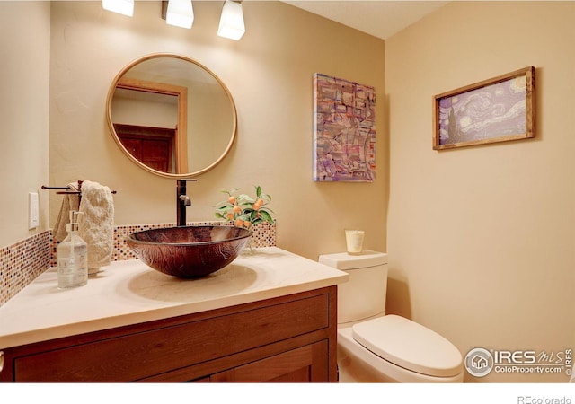 1620 Oak Ave, Boulder, CO 80304 - half bathroom featuring vanity and toilet