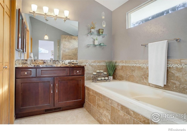 1620 Oak Ave, Boulder, CO 80304 - bathroom with vaulted ceiling, a bath, and vanity