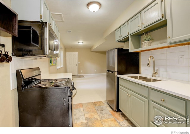 1620 Oak Ave, Boulder, CO 80304 - kitchen featuring stainless steel appliances, tasteful backsplash, open shelves, light countertops, and light stone finish flooring