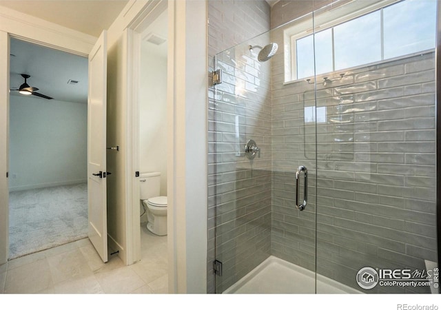 3045 E Trilby Rd Unit B-10, Fort Collins, CO 80528 - bathroom featuring a shower stall, ceiling fan, and tile patterned flooring