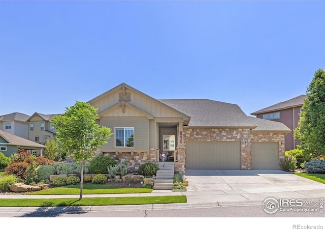 1963 Blue Yonder Way, Fort Collins, CO 80525 - craftsman-style home with a garage, driveway, stone siding, and board and batten siding