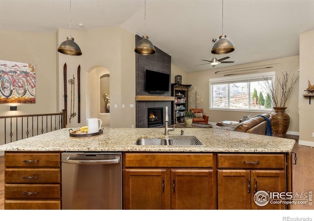 1963 Blue Yonder Way, Fort Collins, CO 80525 - kitchen featuring stainless steel dishwasher, open floor plan, wood finished floors, lofted ceiling, and ceiling fan