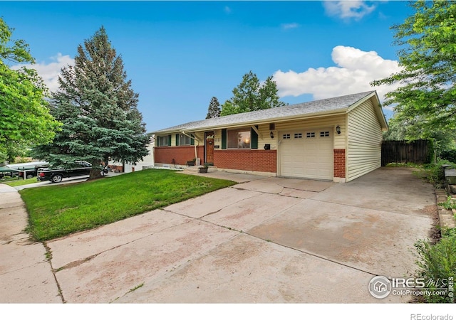 1607 Rushmore Dr, Colorado Springs, CO 80910 - ranch-style home with brick siding, a garage, and concrete driveway