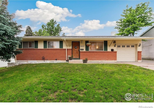 1607 Rushmore Dr, Colorado Springs, CO 80910 - ranch-style house featuring brick siding, a garage, a front lawn, and concrete driveway
