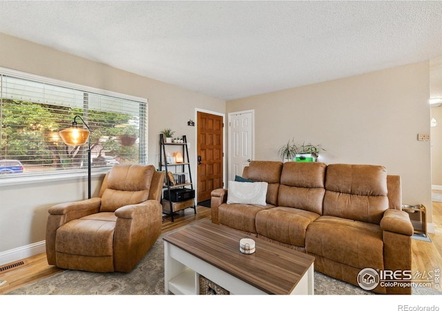 1607 Rushmore Dr, Colorado Springs, CO 80910 - living area with wood finished floors and baseboards