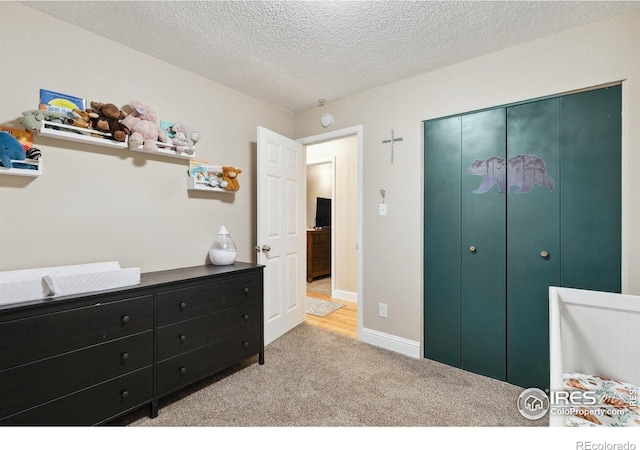 1607 Rushmore Dr, Colorado Springs, CO 80910 - carpeted bedroom with a textured ceiling and a closet