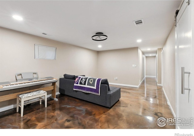 1607 Rushmore Dr, Colorado Springs, CO 80910 - living room with concrete floors, recessed lighting, and an office area