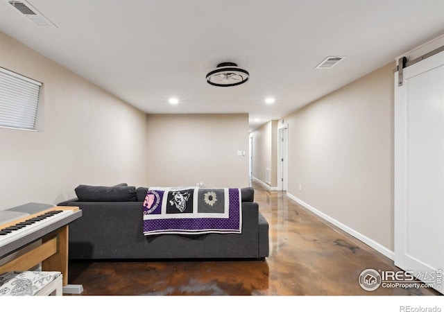 1607 Rushmore Dr, Colorado Springs, CO 80910 - living room with concrete floors, recessed lighting, and a barn door