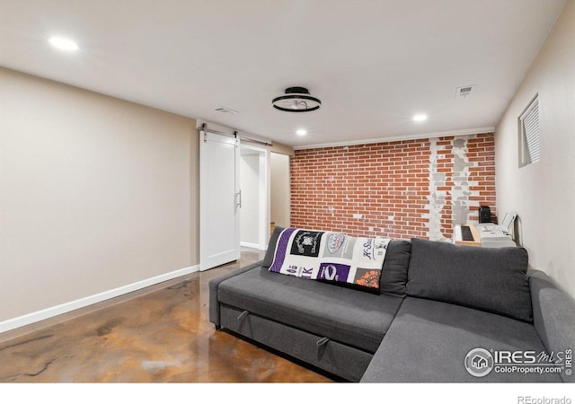 1607 Rushmore Dr, Colorado Springs, CO 80910 - living room featuring concrete floors, a barn door, brick wall, and recessed lighting