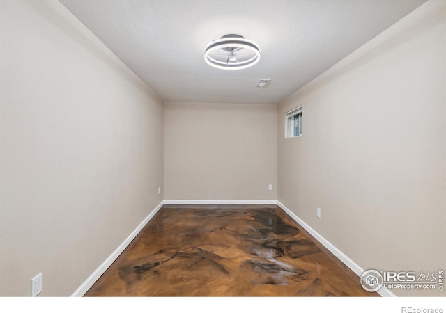 1607 Rushmore Dr, Colorado Springs, CO 80910 - empty room featuring baseboards and concrete flooring