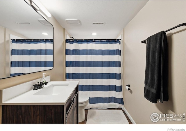 1607 Rushmore Dr, Colorado Springs, CO 80910 - full bathroom featuring vanity, recessed lighting, and curtained shower