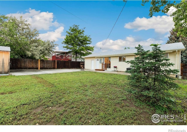 1607 Rushmore Dr, Colorado Springs, CO 80910 - view of yard featuring a patio