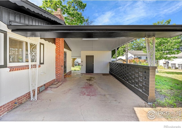 707 E Emma St, Lafayette, CO 80026 - view of vehicle parking featuring an attached carport