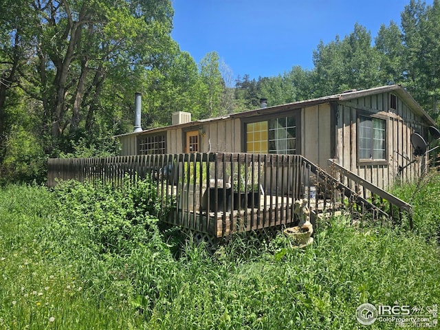 20881 Buckhorn Rd, Bellvue, CO 80512 - back of house with a wooden deck