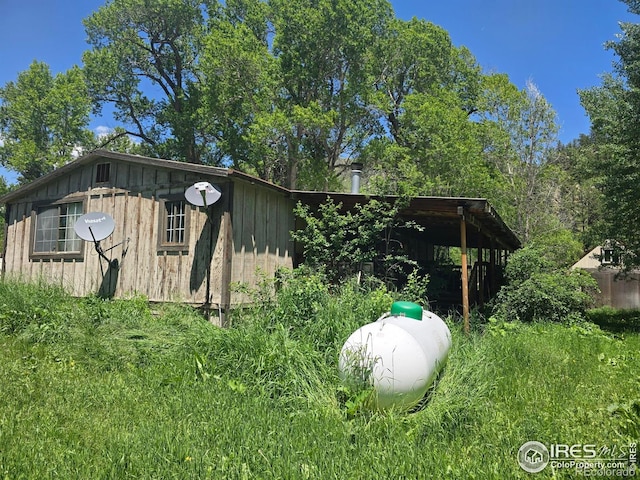 20881 Buckhorn Rd, Bellvue, CO 80512 - view of property exterior with board and batten siding