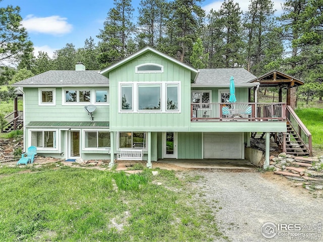 849 Mountain Meadows Rd, Boulder, CO 80302 - back of house with roof with shingles, stairway, a chimney, and driveway