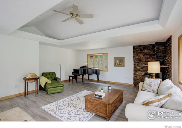 849 Mountain Meadows Rd, Boulder, CO 80302 - living area featuring light wood-style floors, ceiling fan, a raised ceiling, and vaulted ceiling
