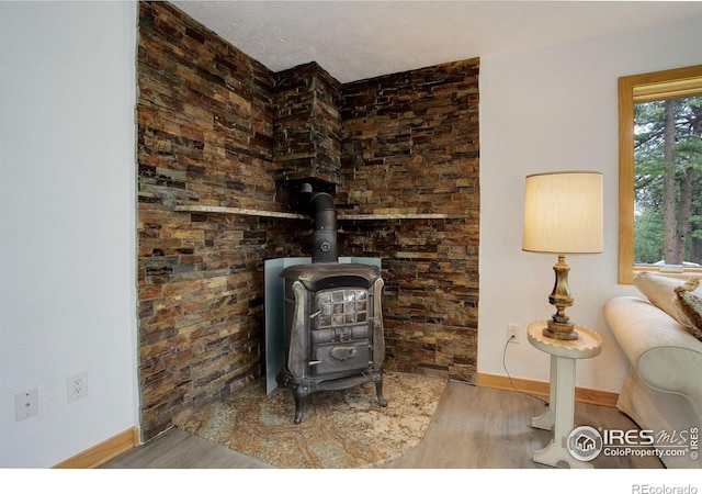 849 Mountain Meadows Rd, Boulder, CO 80302 - detailed view of a wood stove and wood finished floors