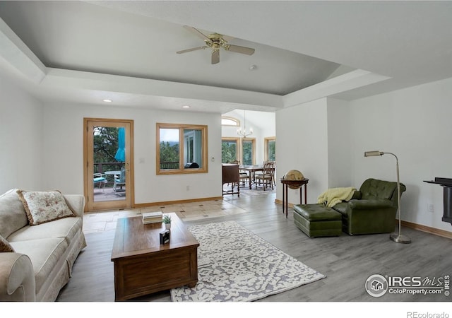 849 Mountain Meadows Rd, Boulder, CO 80302 - living area featuring plenty of natural light, a chandelier, a tray ceiling, recessed lighting, and wood finished floors
