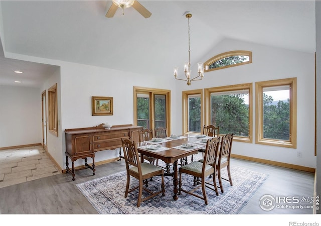 849 Mountain Meadows Rd, Boulder, CO 80302 - dining area featuring vaulted ceiling, light wood-type flooring, a chandelier, and ceiling fan