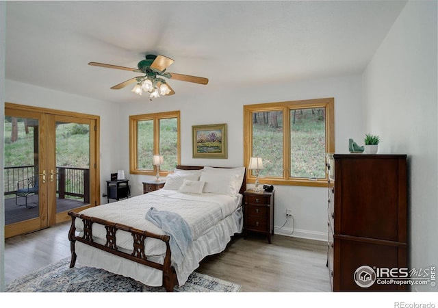849 Mountain Meadows Rd, Boulder, CO 80302 - bedroom featuring access to outside, wood finished floors, french doors, and a ceiling fan