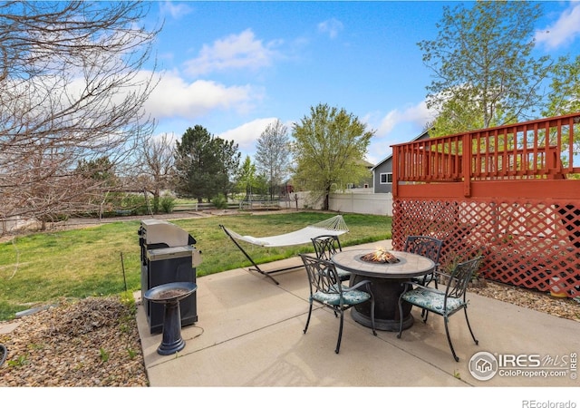 5452 Rustic Ave, Firestone, CO 80504 - view of patio featuring a fire pit, a grill, and a wooden deck