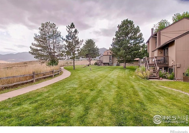 1624 Bradley Ct, Boulder, CO 80305 - view of yard featuring stairway and a wooden deck