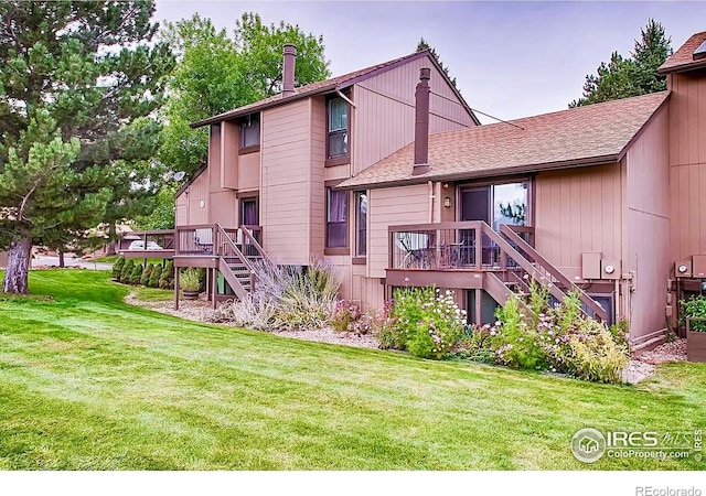 1624 Bradley Ct, Boulder, CO 80305 - rear view of property with stairs, a deck, a lawn, and a shingled roof