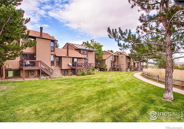 1624 Bradley Ct, Boulder, CO 80305 - view of yard with stairway, a residential view, and a deck