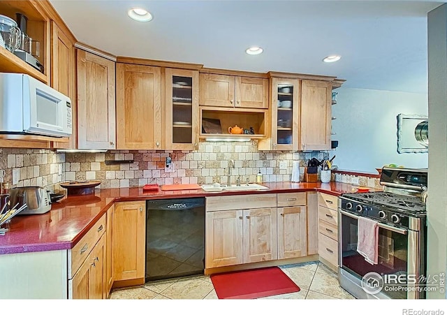 1624 Bradley Ct, Boulder, CO 80305 - kitchen with stainless steel range with gas cooktop, dishwasher, white microwave, light tile patterned flooring, and recessed lighting