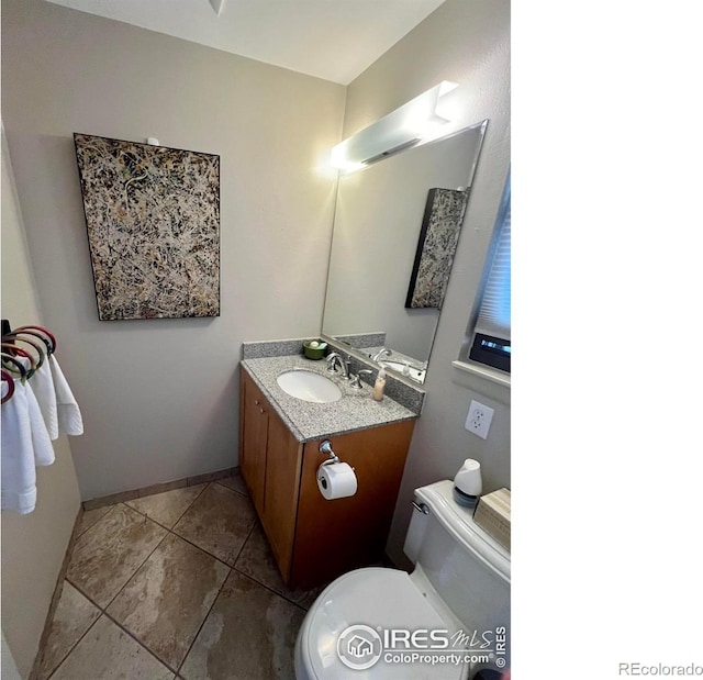 1624 Bradley Ct, Boulder, CO 80305 - half bath with vanity and tile patterned flooring