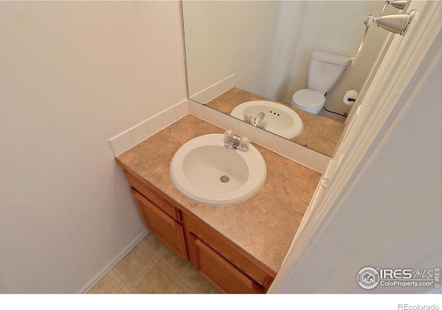 3228 Borrossa St, Evans, CO 80634 - bathroom with vanity and toilet