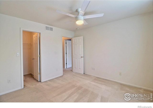 3228 Borrossa St, Evans, CO 80634 - unfurnished bedroom with carpet floors, a spacious closet, a ceiling fan, and a closet