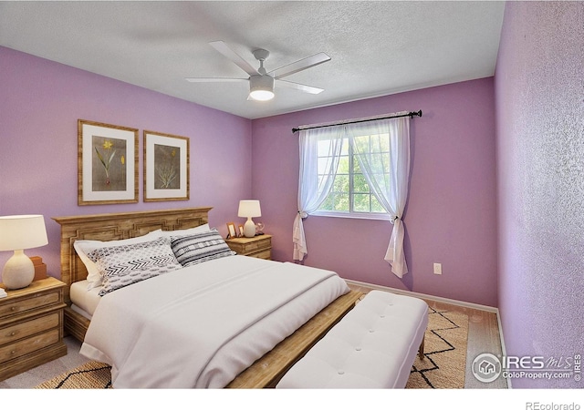 3228 Borrossa St, Evans, CO 80634 - bedroom with carpet flooring, ceiling fan, and a textured ceiling