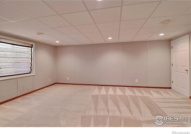 3228 Borrossa St, Evans, CO 80634 - empty room featuring a drop ceiling, carpet floors, and recessed lighting