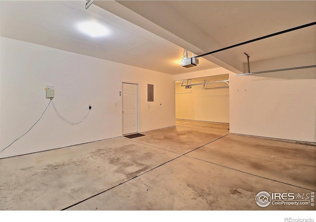 3228 Borrossa St, Evans, CO 80634 - garage featuring a garage door opener and electric panel