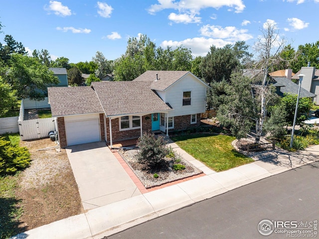 109 Sunflower Dr, Windsor, CO 80550 - view of front facade featuring brick siding, a garage, driveway, a gate, and a shingled roof