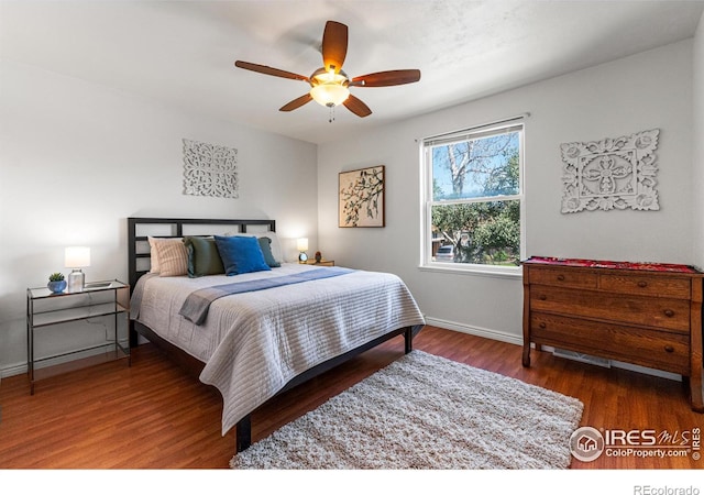 109 Sunflower Dr, Windsor, CO 80550 - bedroom with wood finished floors and ceiling fan