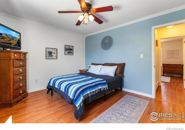 109 Sunflower Dr, Windsor, CO 80550 - bedroom featuring ornamental molding, light wood finished floors, and ceiling fan