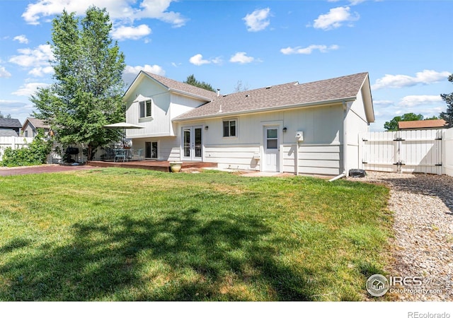 109 Sunflower Dr, Windsor, CO 80550 - rear view of property featuring french doors, a gate, and a shingled roof
