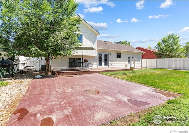 109 Sunflower Dr, Windsor, CO 80550 - back of house with french doors, a fenced backyard, and a patio