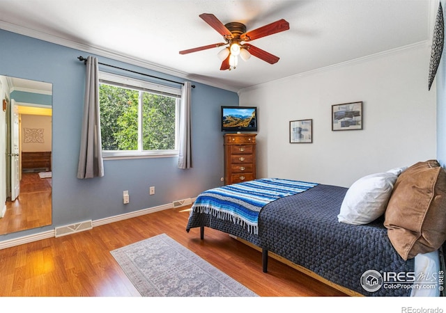 109 Sunflower Dr, Windsor, CO 80550 - bedroom featuring ornamental molding, wood finished floors, and ceiling fan